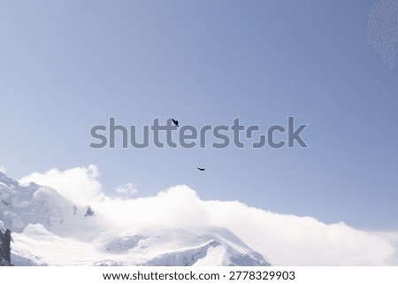 Observation structures and viewing areas frame the snowy alpine scenery at Aiguille du Midi above Chamonix.