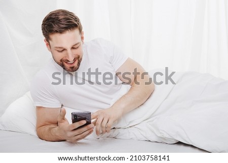 obsession with cell phone costs sleep and recreation time when lie in bed and forget about time  Stock photo © 