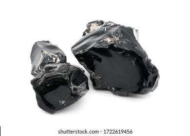 Obsidian stones on white background. Iceland volcanic rocks. Shiny stones. Stones which could kill white walkers . Black mineral - gems. Obsidian rock. Volcanic material. Rough edges. Sharpest rock - Shutterstock ID 1722619456