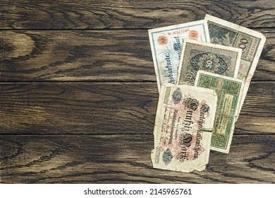 Obsolete european banknotes of non-existent central banks of the early 20th century. Financial or numismatic vintage oak background