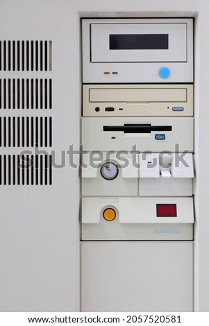 Obsolete PC computer case front view. White old computer with CD-ROM drive and floppy disk drive.