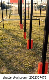Obstacle course race ocr, hanging pendulum in a row, sunset