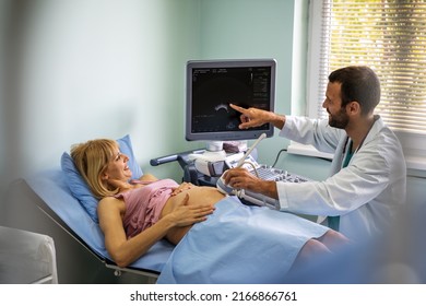 Obstetrician Examining Pregnant Woman Belly By Ultrasonic Scan In Hospital, Clinic.