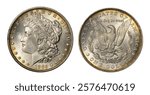 Obverse (heads) and reverse (tails) of U.S. 1885-P Morgan silver dollar isolated on white background. Brilliant uncirculated with gold toning and bag marks. Minted in Philadelphia.