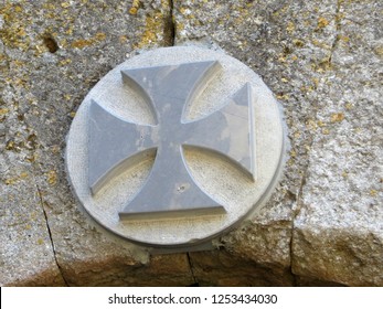 Occitan cross (Cathar cross) over a door in  medieval La Couvertoirade (Larzac France)                               