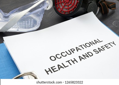 Occupational Health And Safety Ohs Act With Blue Folder.