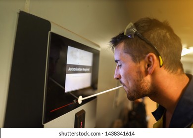 Occupational Health And Safety Safe Work Practices Construction Miner Conducting Self Pre Alcohol Testing On Machinery Devices Prior Entry To Work On Coal Mine Site Areas Perth, Australia