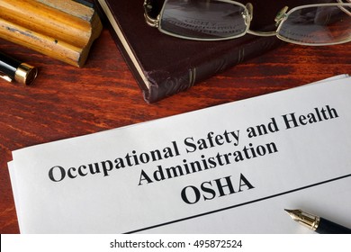 Occupational Safety And Health Administration  OSHA  And A Book.