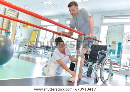 Occupational therapist helping patient to walk Stock foto © 