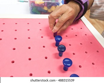 Occupational Therapy - Exercising with peg board. hand function training for stroke patient.