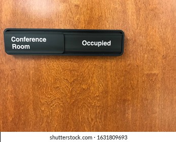 Occupied Conference Room Sign On A Wooden Door