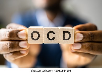 OCD Perfectionist Obsession. Perfectionist With Wooden Blocks