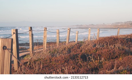 Ocean Beach Sandy Dune, Monterey Nature, California Coast Flora, USA. Autumn Or Winter Weather. Trail Path, Wooden Boardwalk From Planks On Shore, Cold Sea Waves. Moody Calm Tranquil Sunset Atmosphere