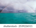 Ocean blue cloudy rainy rainbow Kaneohe bay Hawaii