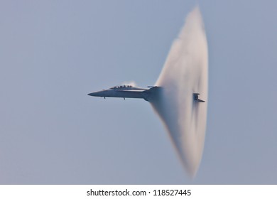 OCEAN CITY - JUNE 14:F-18 Super Hornet Travels Subsonic Speed With Visible Vapor Cone On June 14, 2012 In Ocean City, Maryland. Vapor Cone Is Also Called Sonic Boom And Is A Very Rare Observed