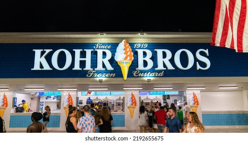 Ocean City, Maryland, USA - August 3 2022: The Famous Kohr Bros Ice Cream Shop On The Boardwalk, Busy Late At Night. 