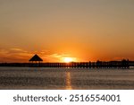 Ocean City, Maryland, USA  A sunset over the Assawoman Bay and pier.