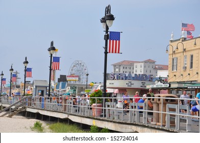 OCEAN CITY, NEW JERSEY - SEPTEMBER 1: Ocean City Boardwalk in New Jersey, as seen on September 1, 2013. The boardwalk is 2.5 miles long and one of the most well-known boardwalks in the world.