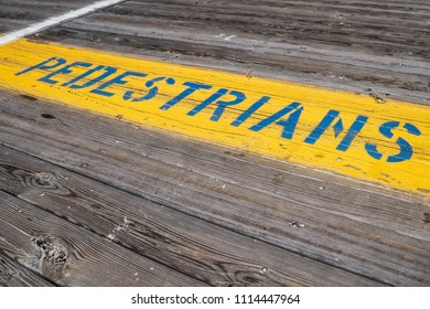 Ocean City New Jersey Shore Boardwalk Pedestrian Traffic Sign On Yellow Background With Boardwalk Wood Grain Planks