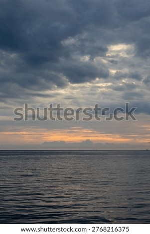 Ocean and Cloudy Sky at Dusk