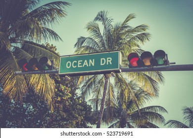 Ocean Drive sign with palm trees in Miami Beach, Florida. Vintage colors