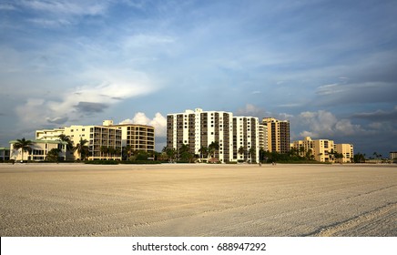 Ocean front hotels, timeshares and apartment rentals as seen on Fort Myers Beach at sunset. 
