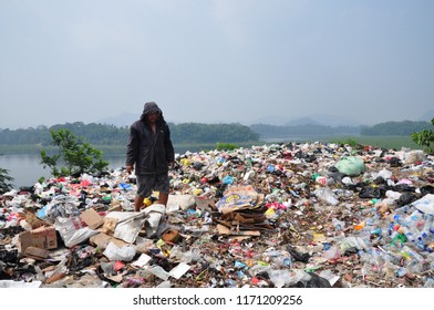 The Ocean Of Garbage In The River Banks. People Collecting Plastic Garbage In The One Of Poluted River In Indonesia, Citarum River, West Java Province (2017). Especially After The Rain, Many Garbage.