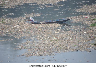 The Ocean Of Garbage In The River Banks. People Collecting Plastic Garbage In The One Of Poluted River In Indonesia, Citarum River, West Java Province (2019). Especially After The Rain, Many Garbage.