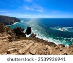 Ocean, mountains and people at Cabo da Roca Portugal