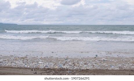 Ocean Pollution Concept. Plastic Garbage On The Beach. Environmental Disaster.