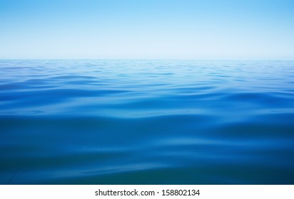 ocean or sea or lake water surface with horizon