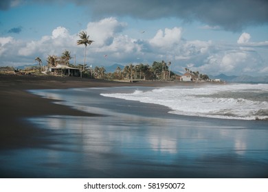 Ocean shore line with waves on a beach. Bali, Indonesia.