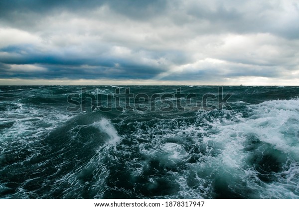 Ocean storm. Storm waves in the open ocean. Not a\
calm open sea.