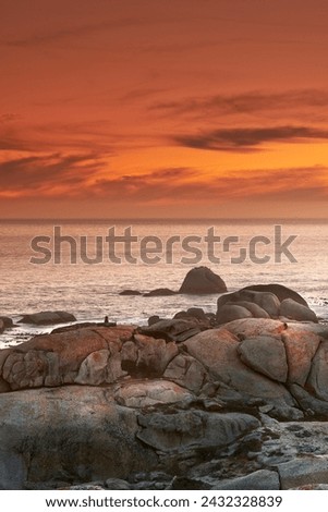 Ocean, sunset and waves on rocks on tropical island and tourism destination for summer vacation in nature. Sky, clouds and golden color on torrey pines beach, peace and outdoor travel in california