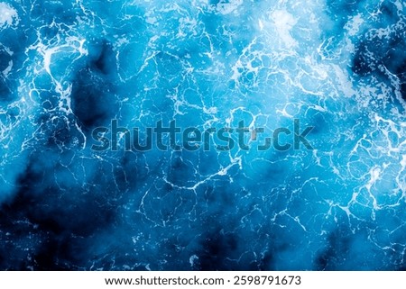 Ocean surface background. Top view of captivating foamy water. Can be used in covers, packaging, posters, textures, wallpapers, art and design projects. Stunning nature background image.