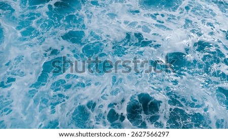 ocean surface foaming from waves, texture and shape of sea water, aerial view. 