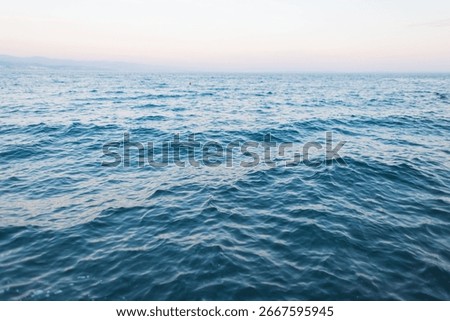 Ocean surface with rippling water patterns in natural light, peaceful seascape for backgrounds or nature themes