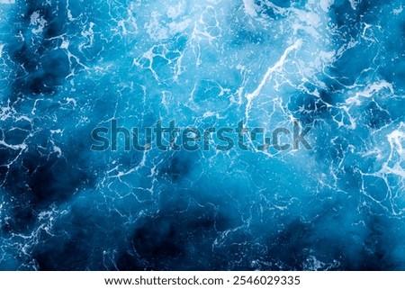 Ocean surface texture. Top view of amazing water with foam. Can be used in covers, packaging, posters, textures, brochures, art, and design projects. Creative nature background image.
