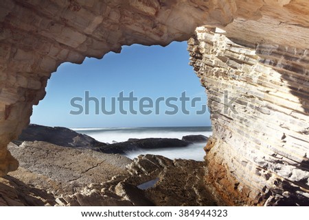 Ocean view from a arch window of limestone
