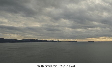 Ocean view from a hill (cloudy sky)