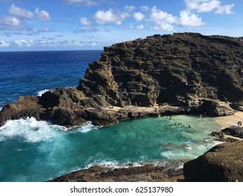 Ocean view with small beach between hills at east Honolulu, Hawaii USA.