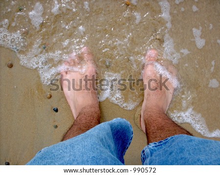 The ocean is washing ashore on my piggie toes.