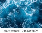 Ocean water background with foam. Ocean water splash. Not a calm