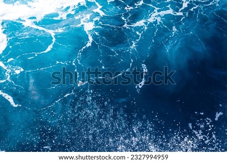 Ocean water background with foam. Ocean water splash. Not a calm