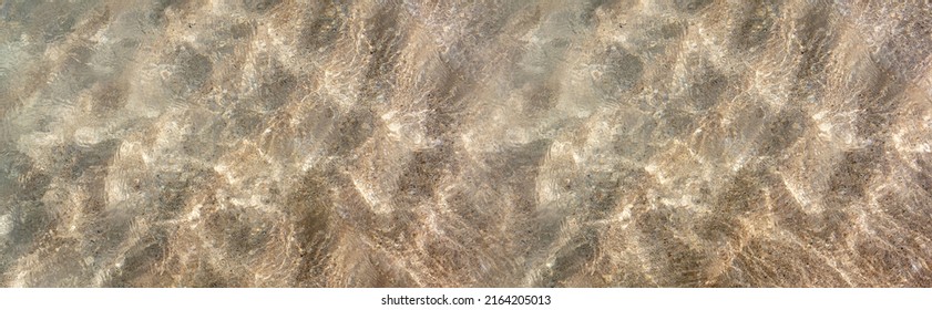 Ocean water texture background. Sandy sea bottom  top view, banner. Shallow water surface. Greek island, summer template - Shutterstock ID 2164205013