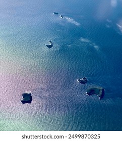 Ocean waters with rain down reflection over the North Sea.