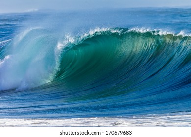 Ocean Wave Curl  Clean Ocean Wave Rolling Curling Lip Crashing On Shallow Sandbars.