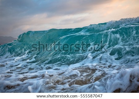 Ocean wave at sunset time