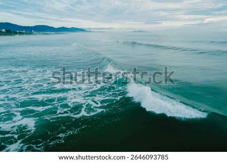 Ocean waves breacking in Brazil. Drone view of Campeche beach