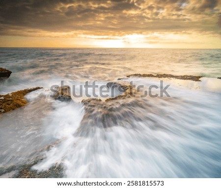 Similar – Image, Stock Photo Ethereal clouds flow over the serene hills of Fuerteventura as the day gently breaks
